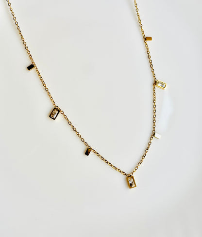 Gold necklace with small rectangular pendants