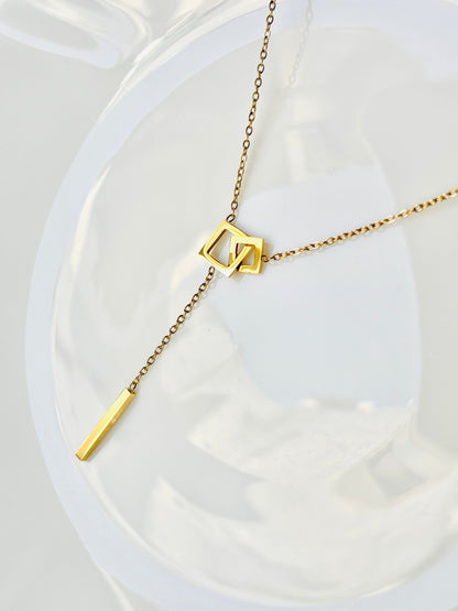 Gold necklace with geometric pendant, square, infinity