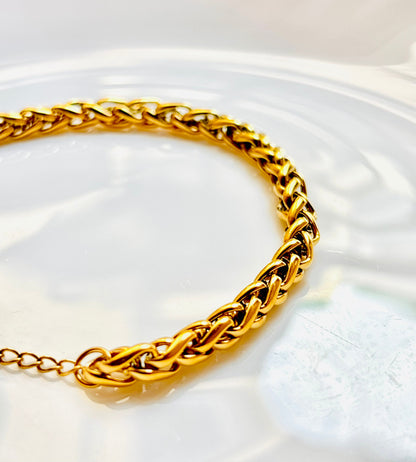 Gold braided bracelet, shiny